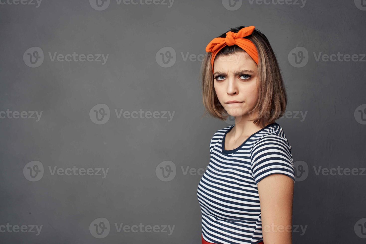 woman in striped t-shirt with orange headband fashion glamor photo