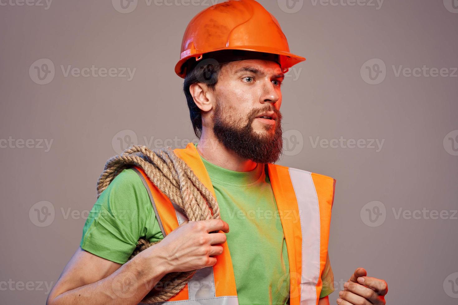 Bearded man in a construction firm orange paint industry photo