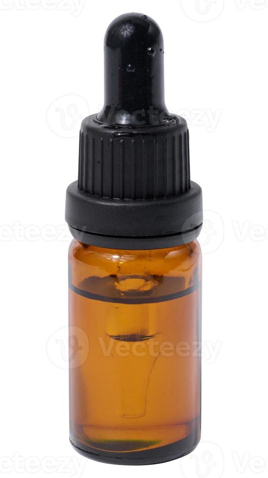 A glass brown bottle with a dropper on a white isolated background, a container for cosmetic products photo