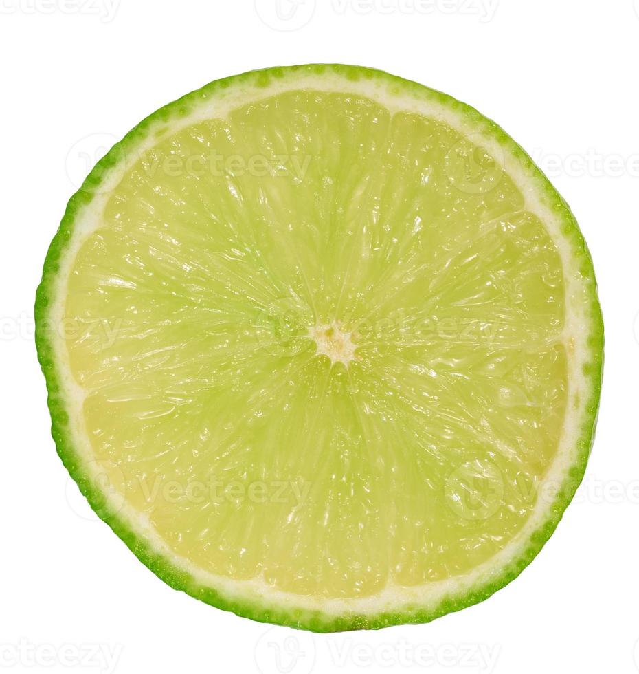 Round piece of juicy lime on a white isolated background photo