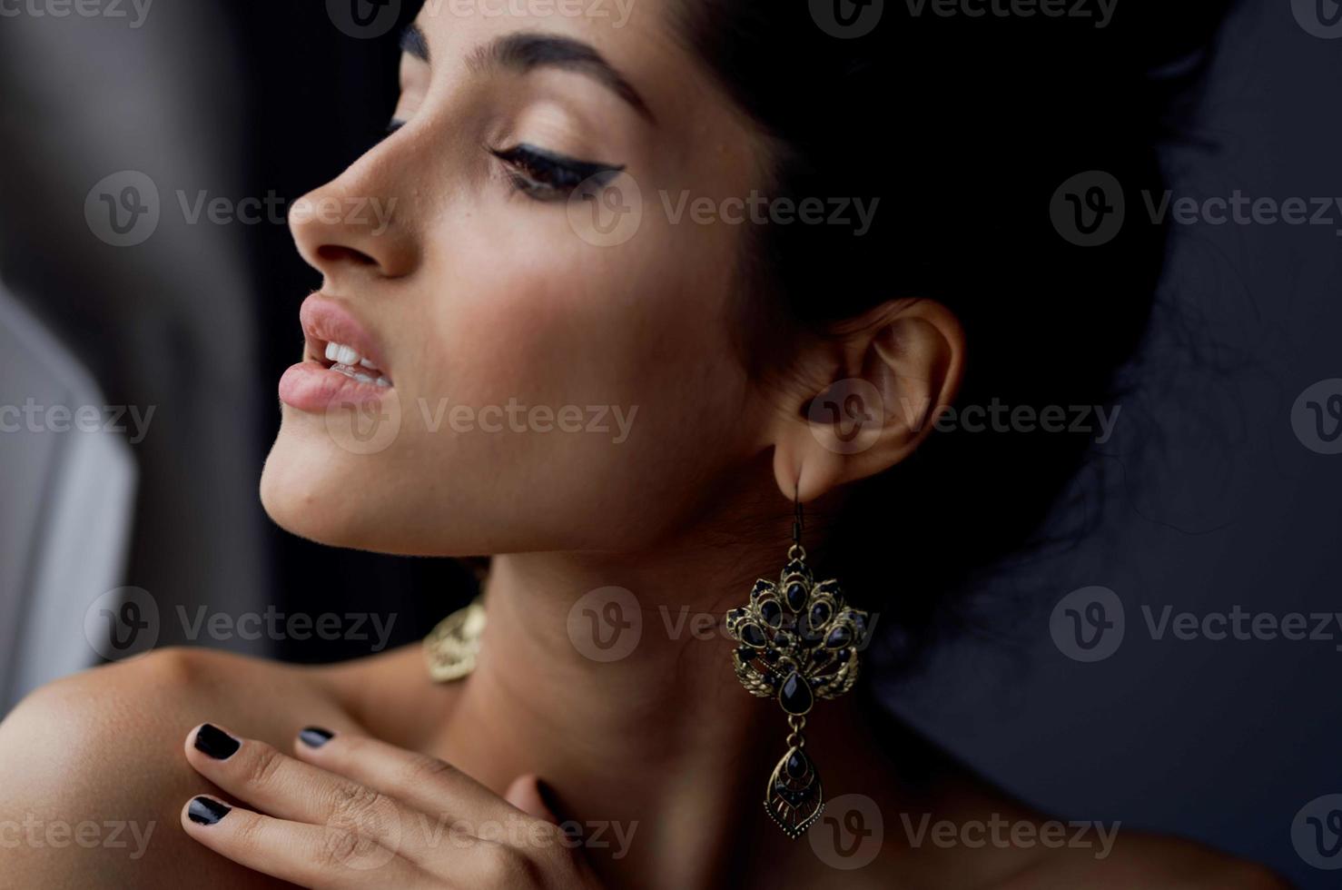 brunette near window posing attractive look earrings elegant style photo