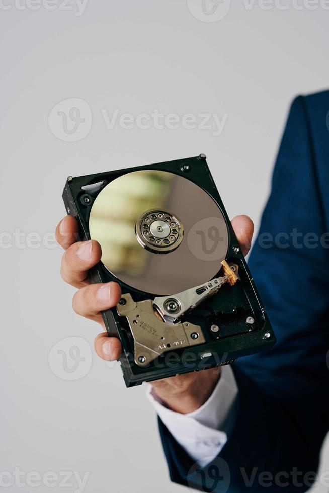 computer hard drive in hands technology close-up photo