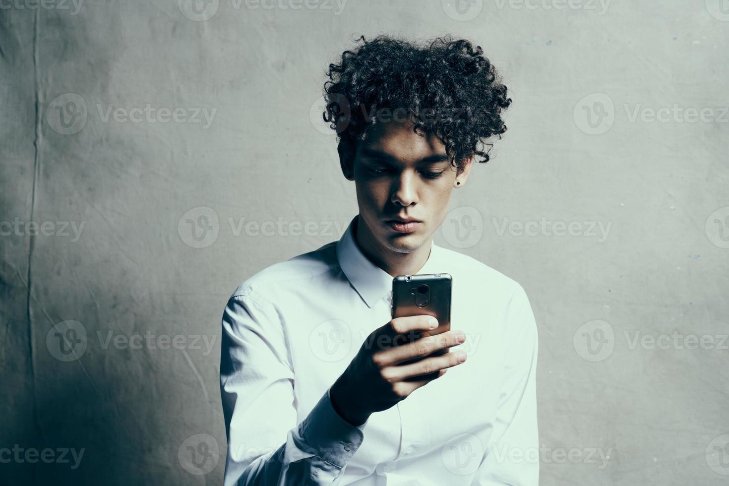 man in shirt curly hair modern style studio manager photo