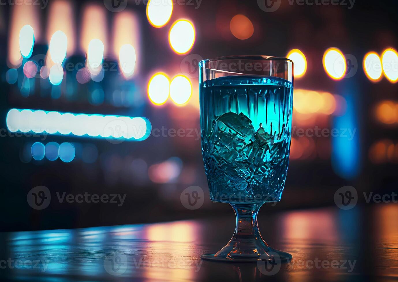 a glass with a beautiful cocktail stands on the bar counter in a nightclub. photo