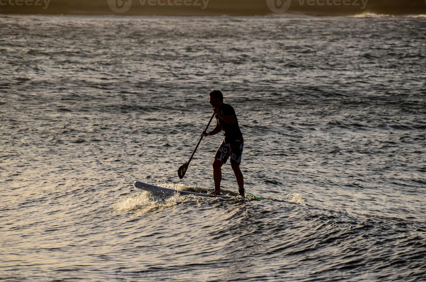 Surfing in the ocean photo