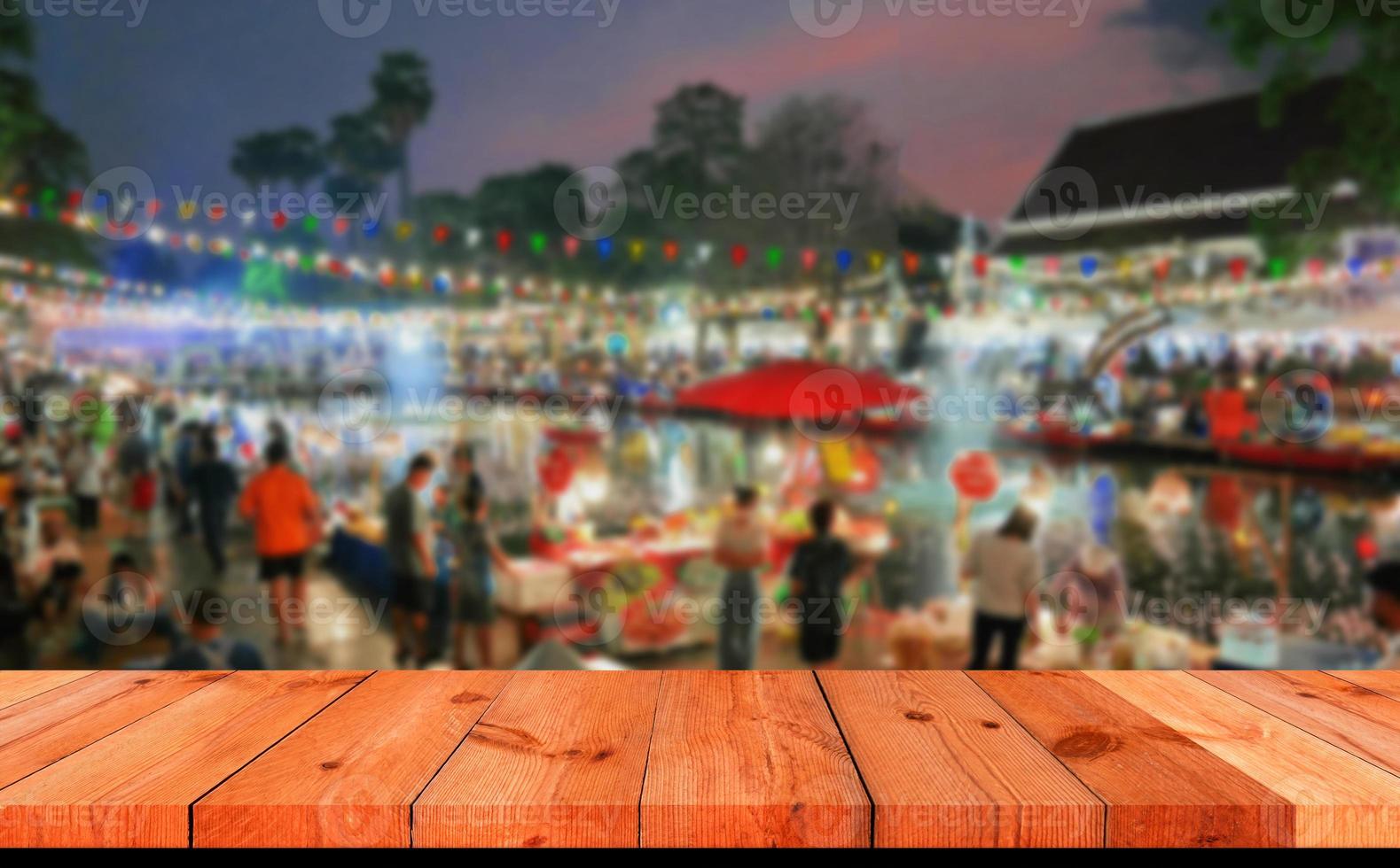 perspective board over blurred night market photo