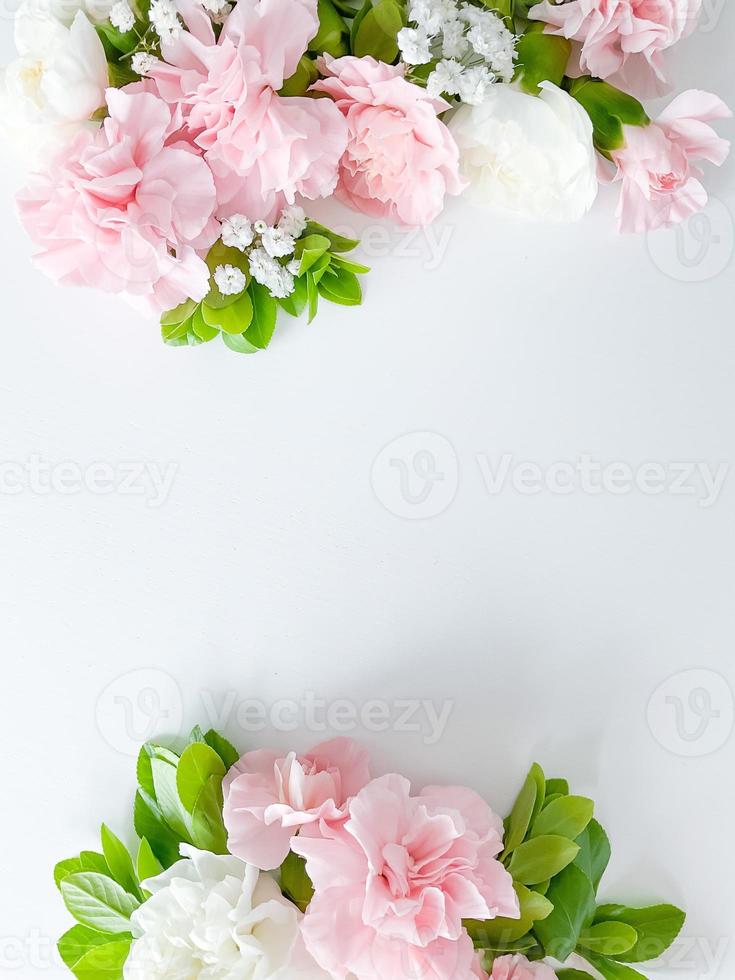 Border frame made of pink and white carnations photo