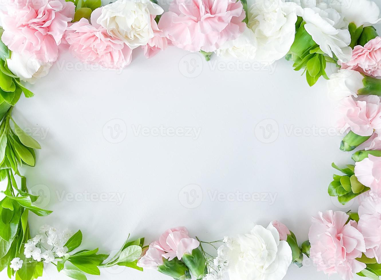 Pink floral. assorted pink flowers border on white photo