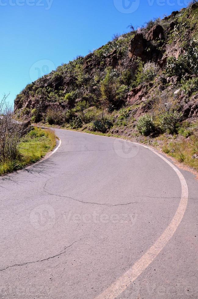 Road through the scenic landscape photo