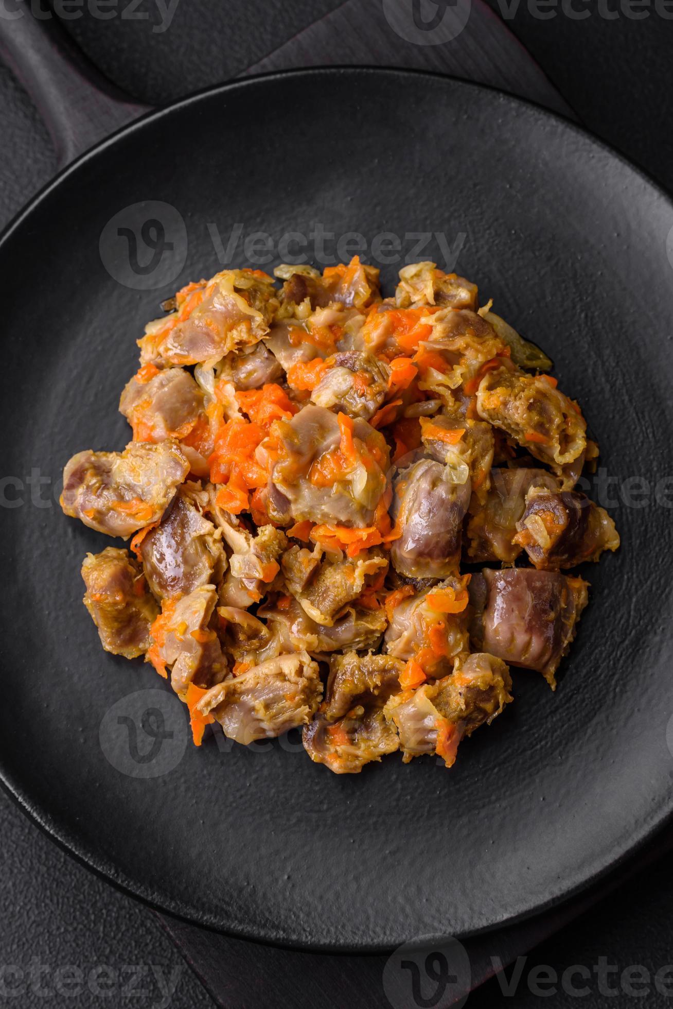 Delicious stewed chicken gizzards with carrots and tomato 22021331