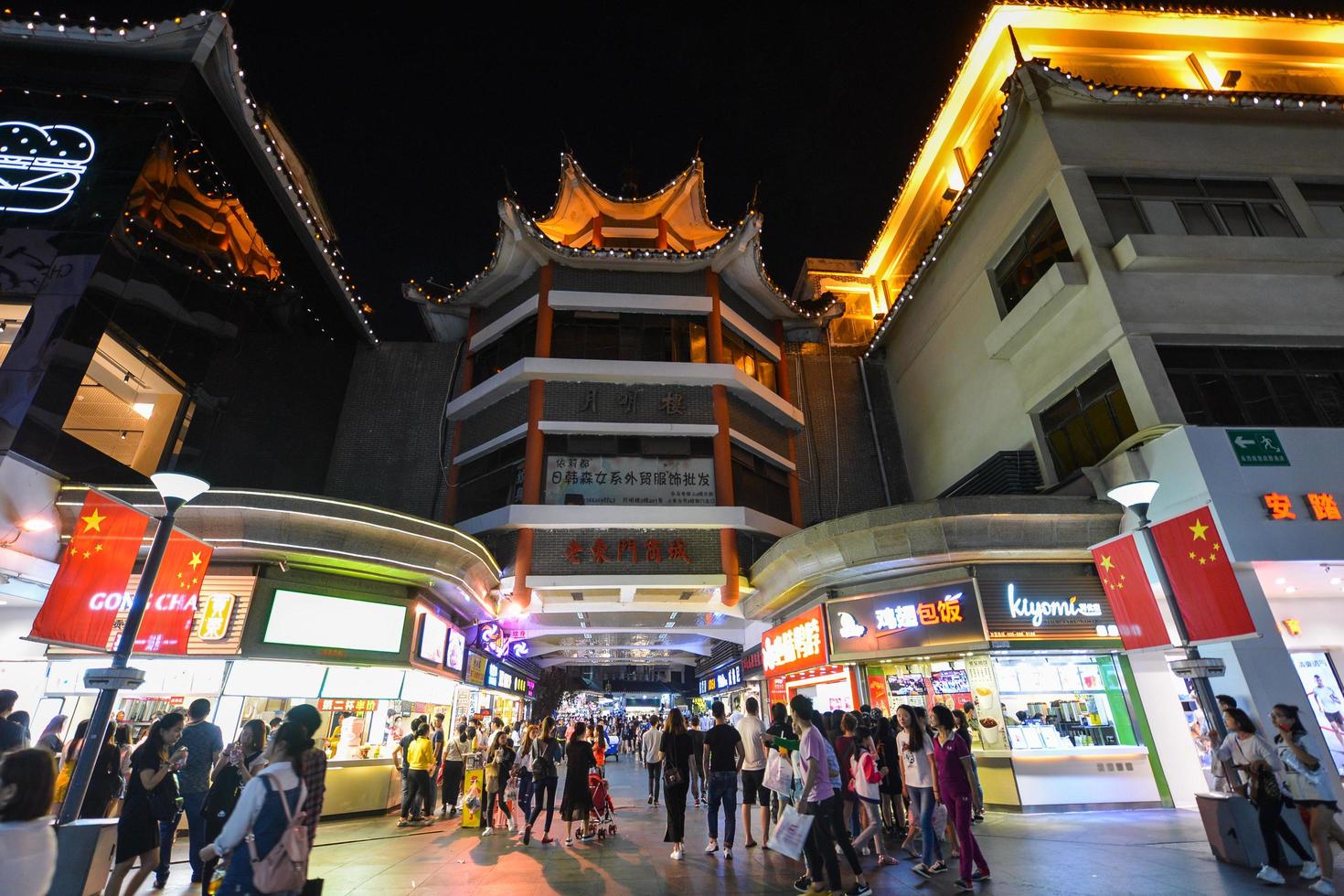 SHENZHEN, CHINA-APR 08, 2017-Shoppers and visitors crowd the famous Dongmen Pedestrian Street. Dongmen is a shopping area and subdistrict within Luohu District of Shenzhen on April 08, 2017. photo