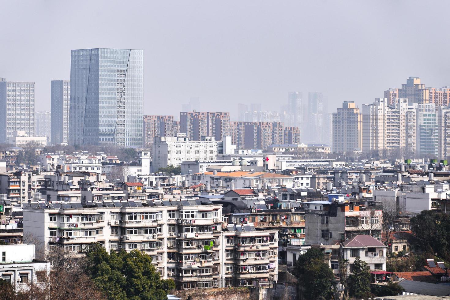 WUHAN, CHINA - JAN 24, 2017- Yellow Crane Tower against blue sky in Snake Hill, Wuhan, China. The three Chinese characters mean yellow crane tower. photo