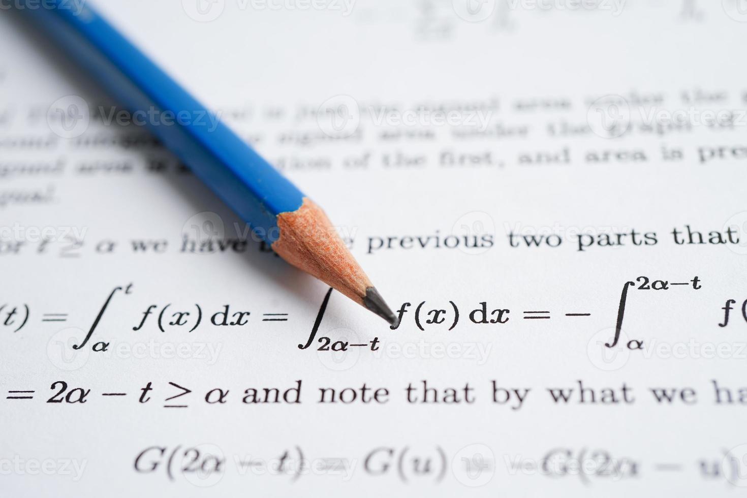 Pencil on mathematic formula exercise test paper in education school. photo