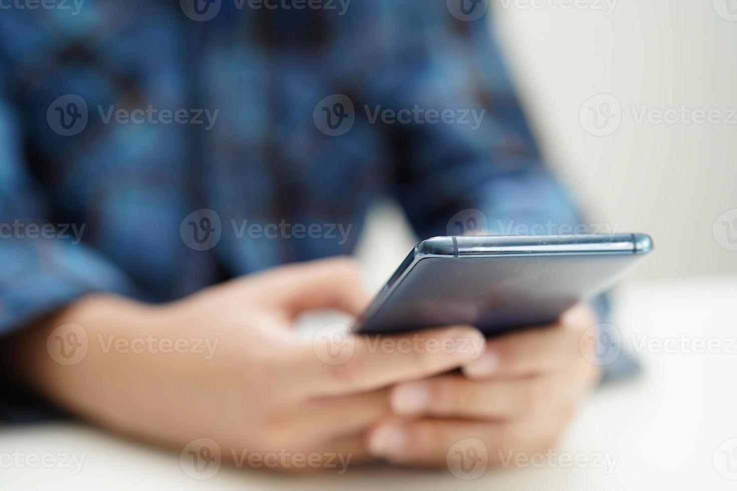 Asian teenage using mobile application in digital smartphone technology for learning. photo