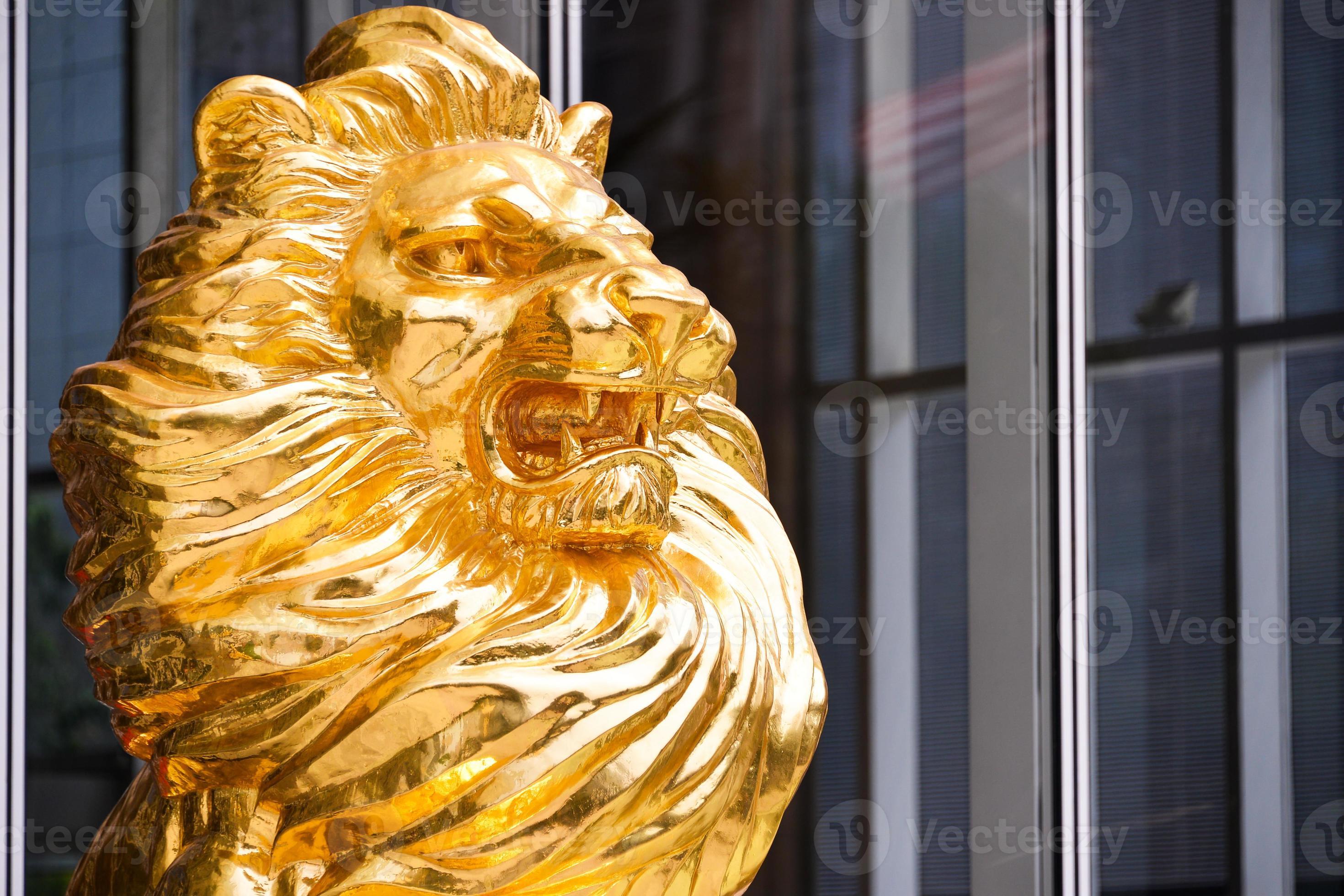 Gold Lion statue in front of building 22033313 Stock Photo at Vecteezy
