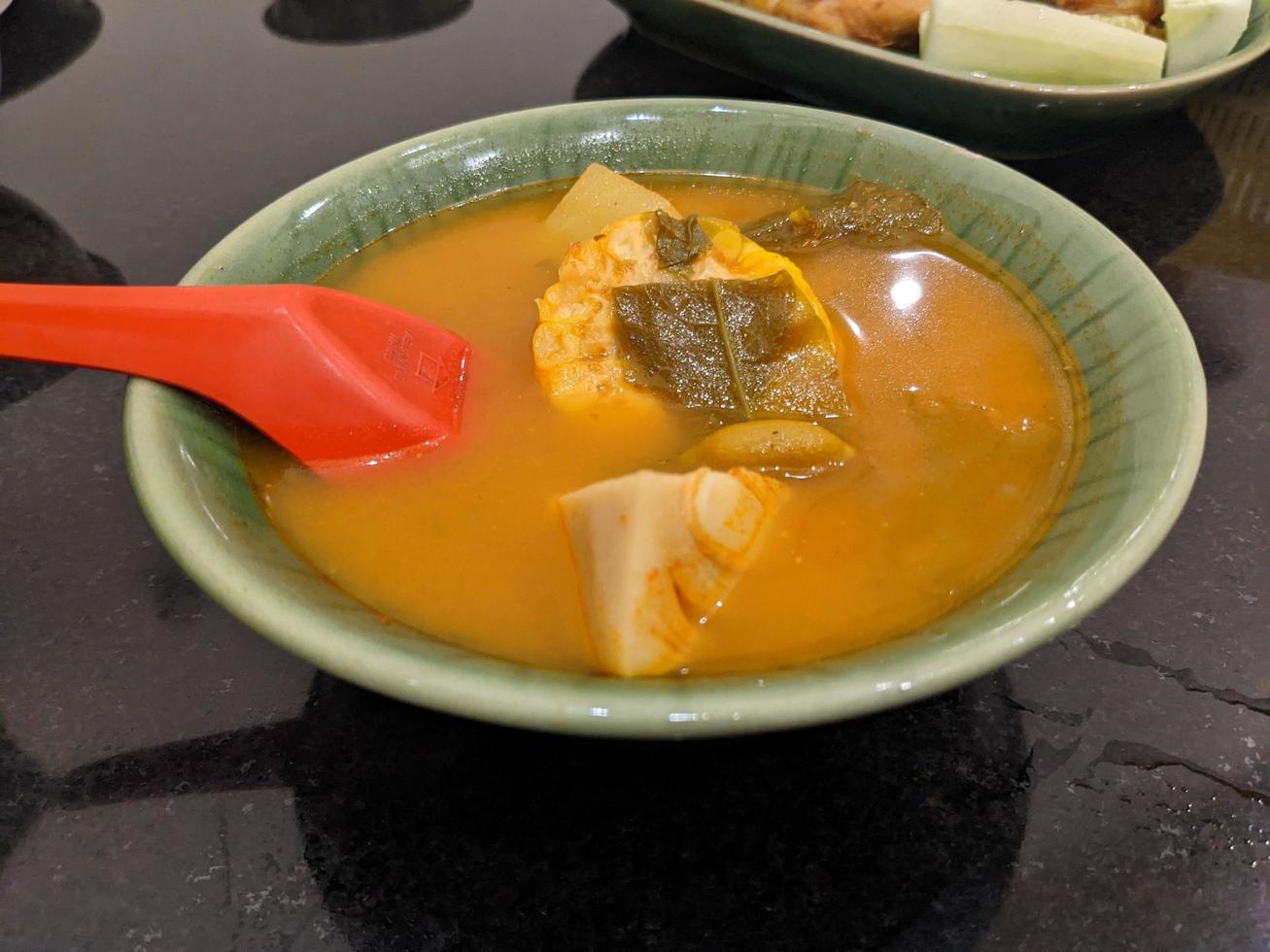 Sayur Asem traditional food of Javanese Indonesia, vegetable food with traditional taste. The photo is suitable to use for food background, poster and food content.