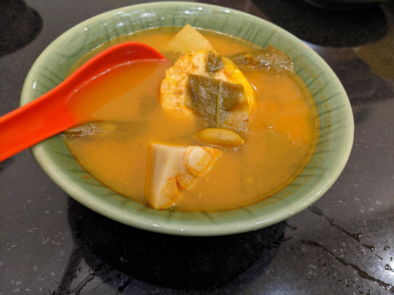 Sayur Asem traditional food of Javanese Indonesia, vegetable food with traditional taste. The photo is suitable to use for food background, poster and food content.