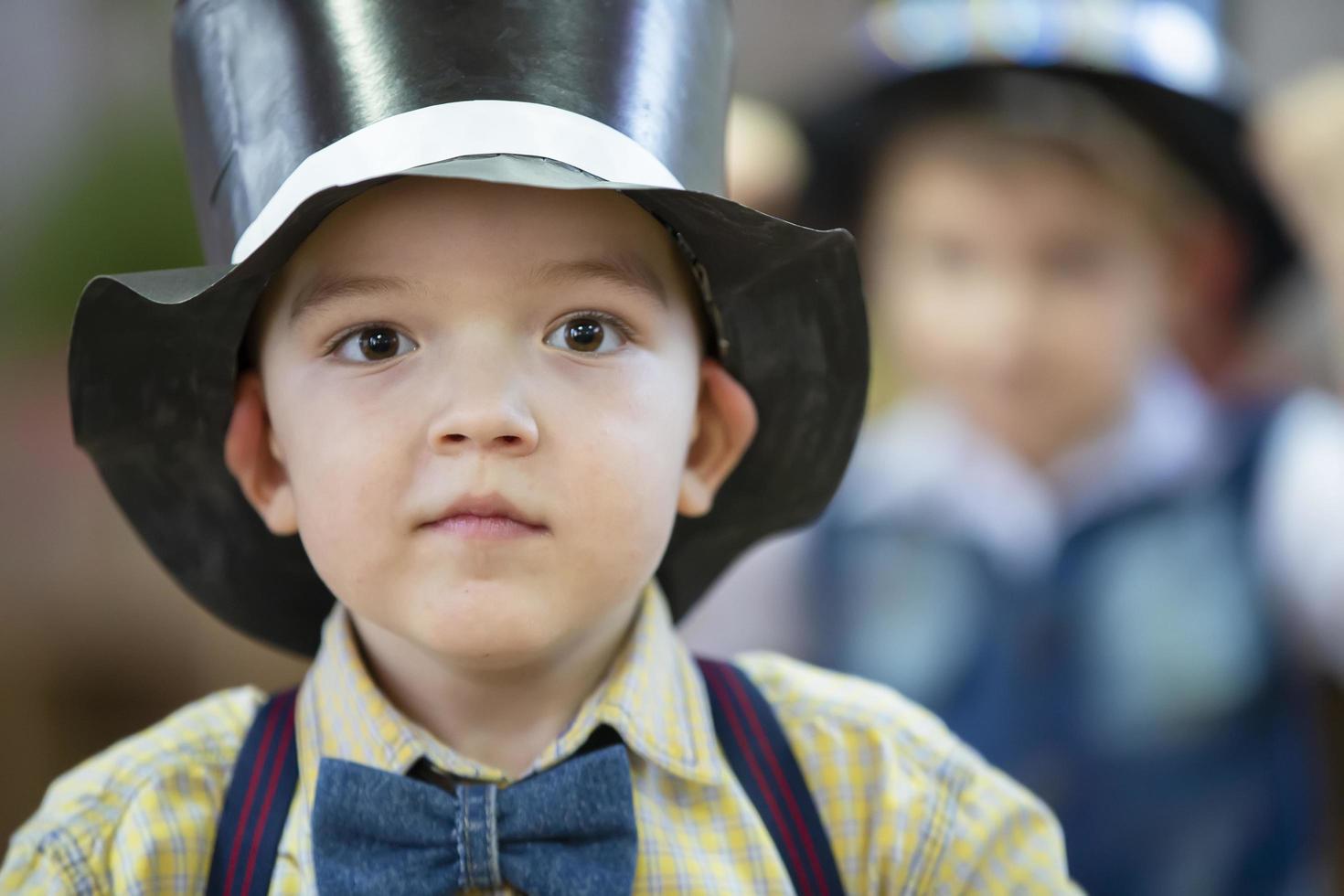 Funny boy in a hat. Portrait of a five year old child. photo