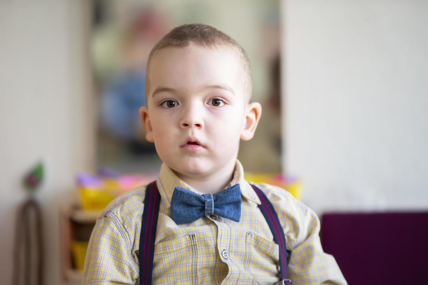 A beautiful five year old child. The boy is a preschooler. photo