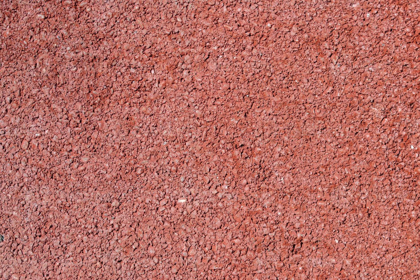 Close up of red asphalt road texture background photo