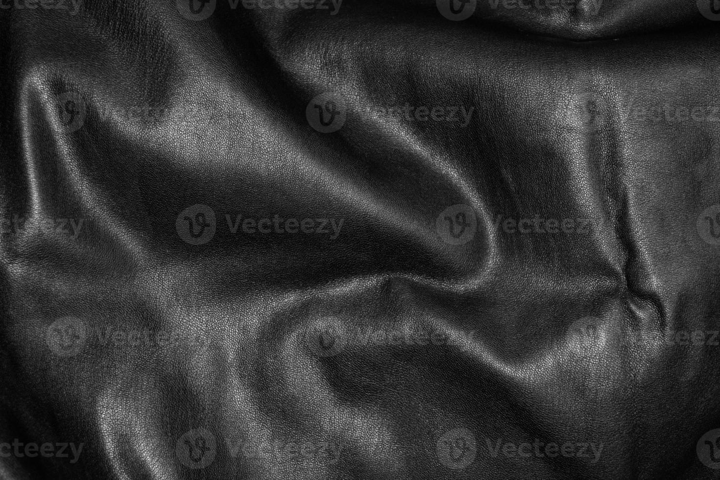 Close up black luxury leather material texture details background full frame photo