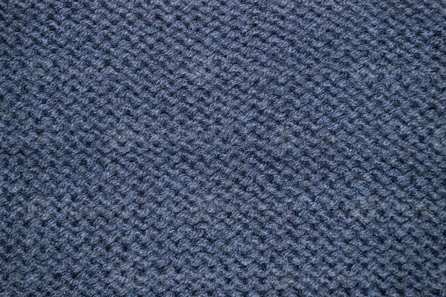 A blue knitted sweater with a pattern of the woven pattern photo