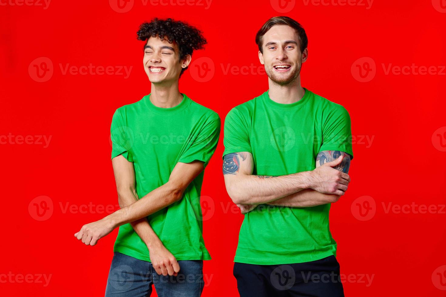 two friends green tshirts communication lifestyle red background