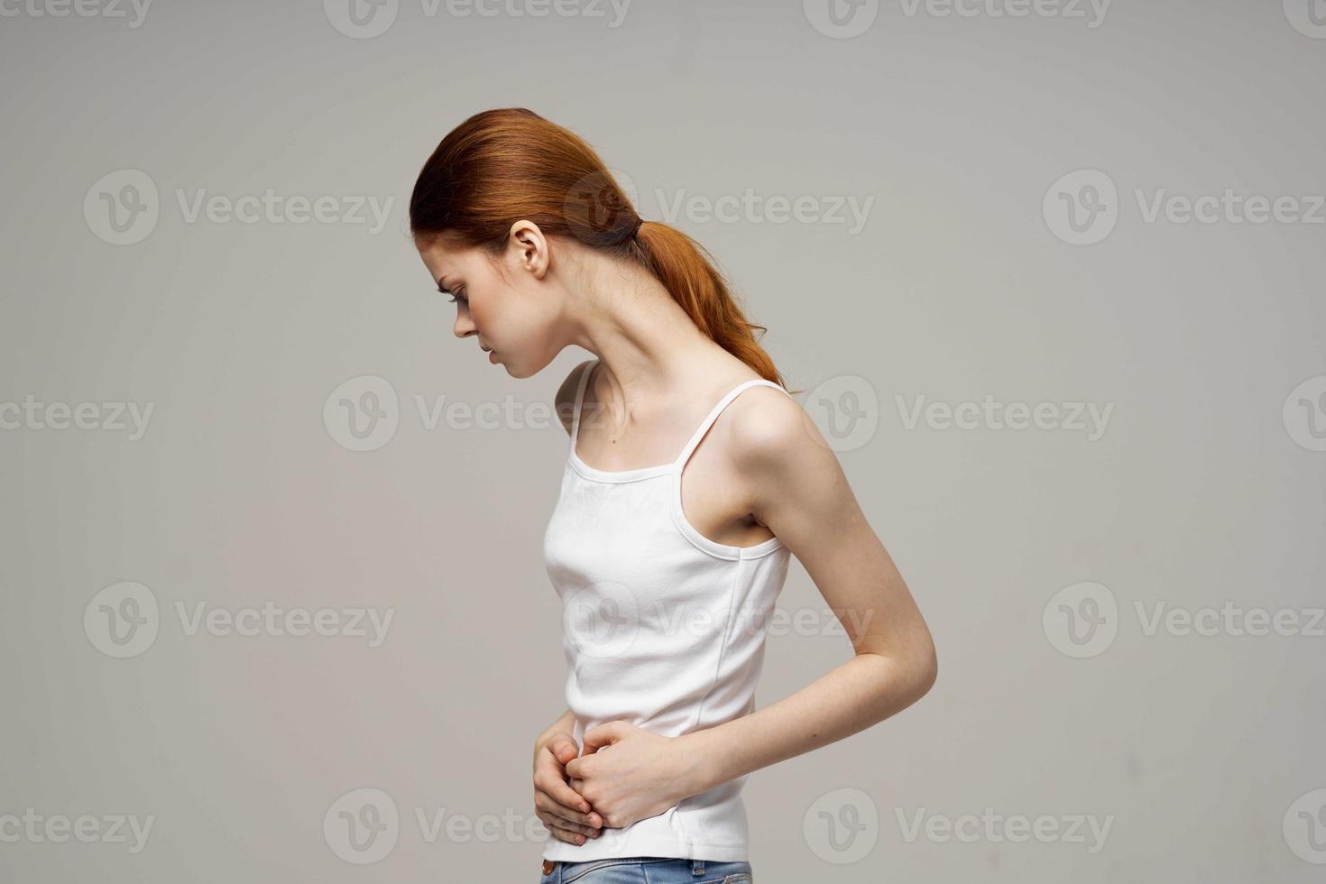 woman menstruation health problems gynecology disorder light background photo