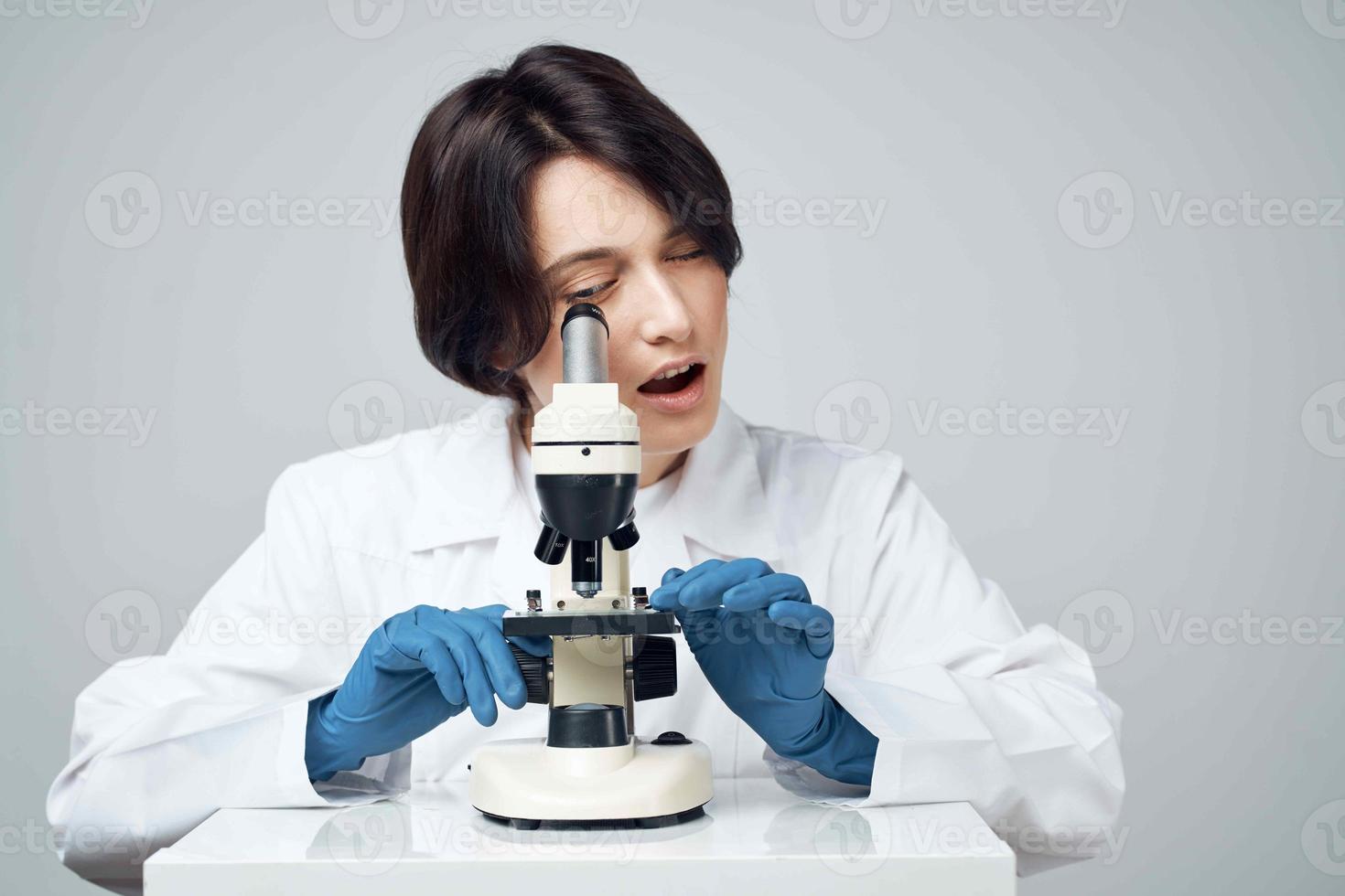 woman laboratory assistant microscope biology research science photo