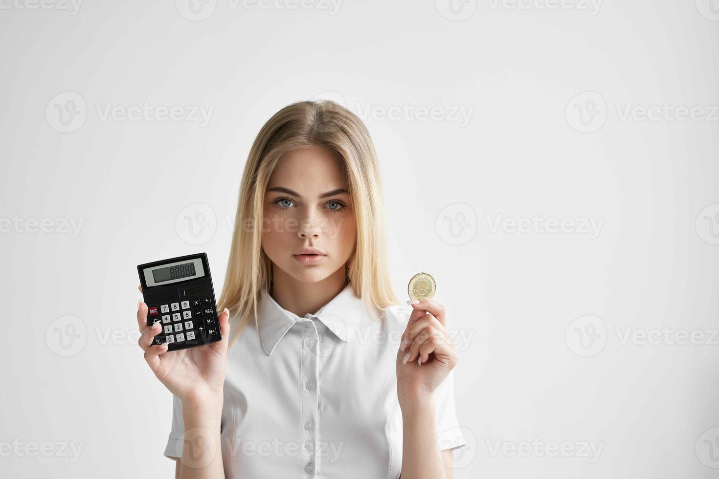 cheerful woman in a white shirt with a folder in hand light background photo