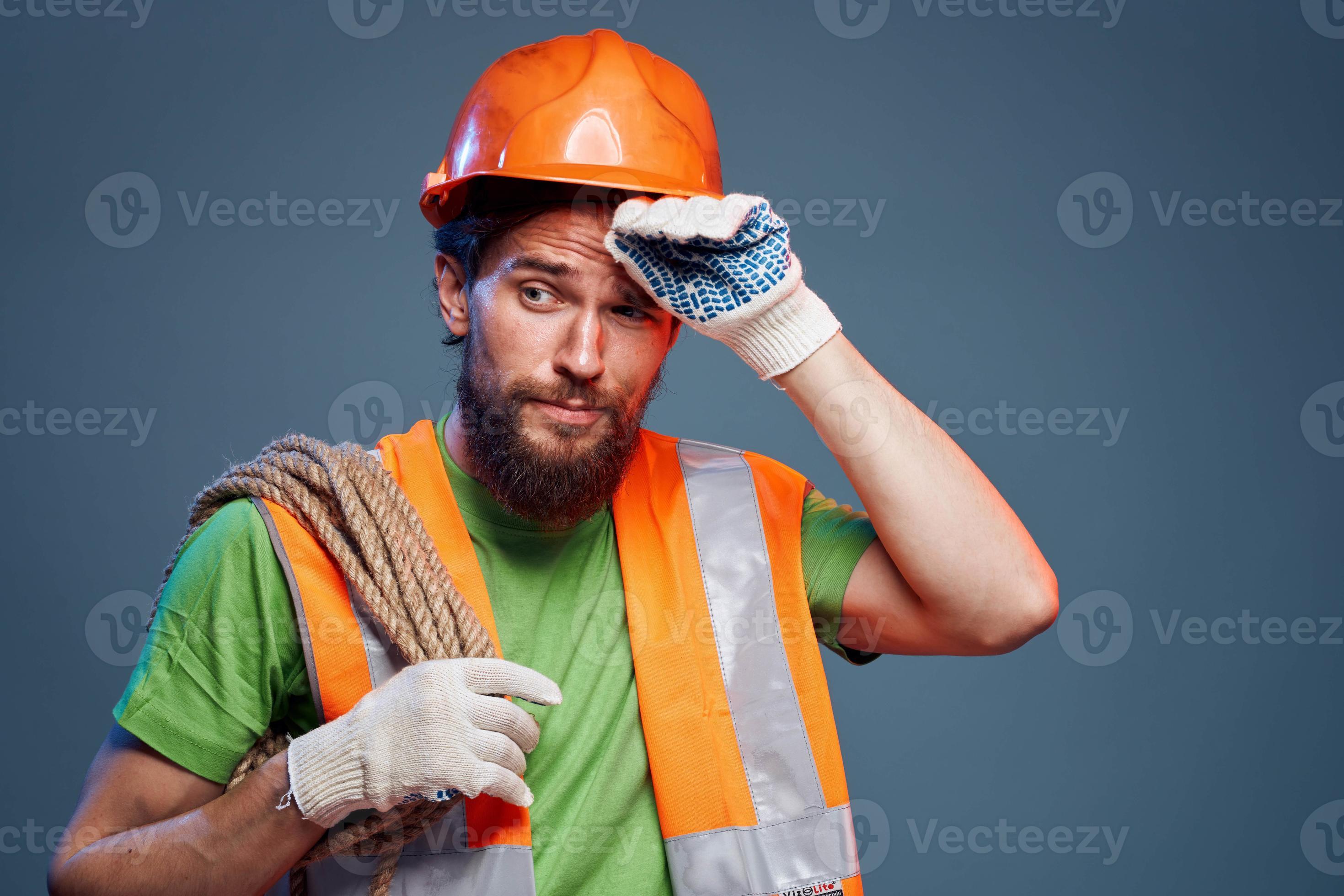 Man in orange paint hard work Professional blue background 22056665
