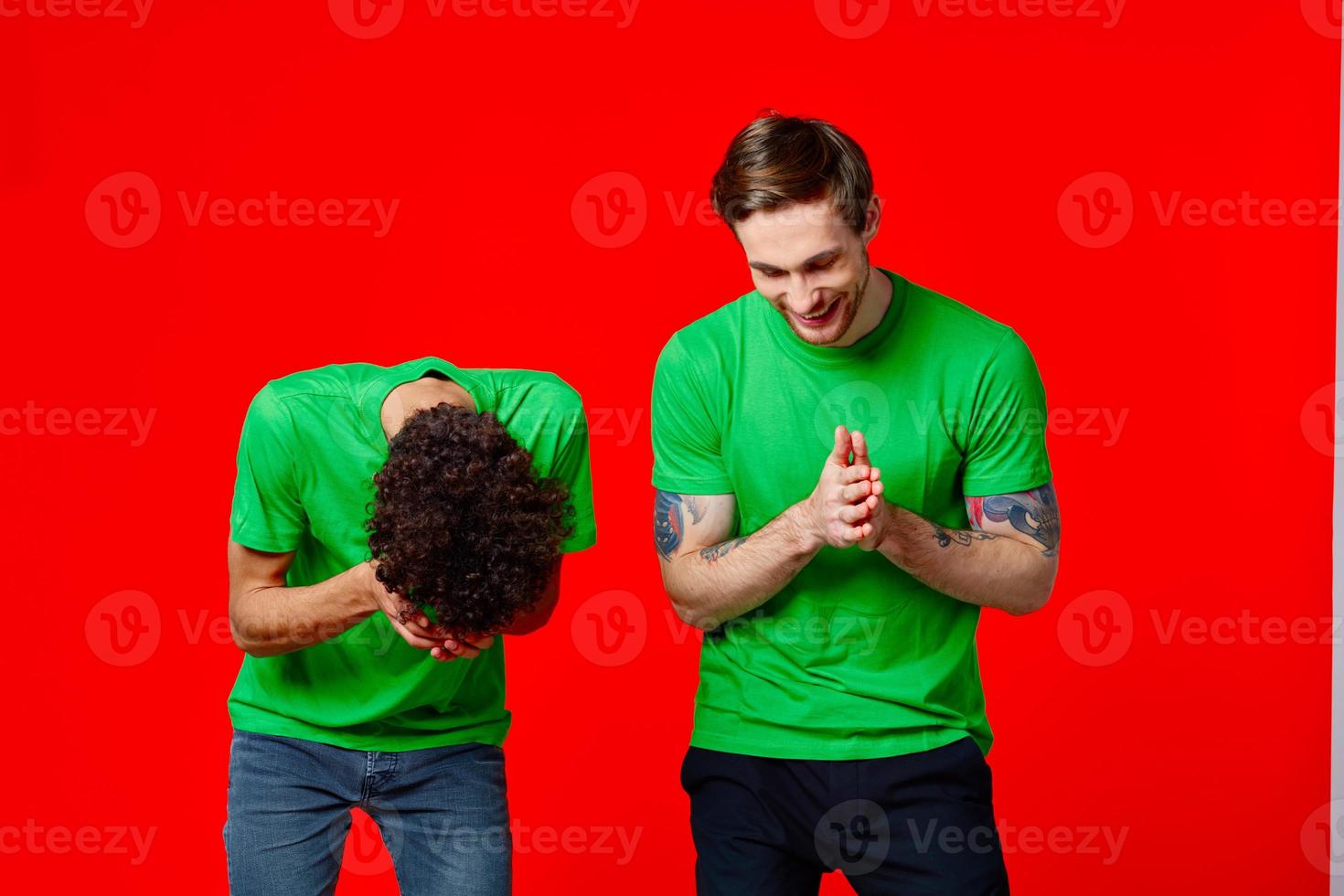 Cheerful friends laugh communication emotions red background photo