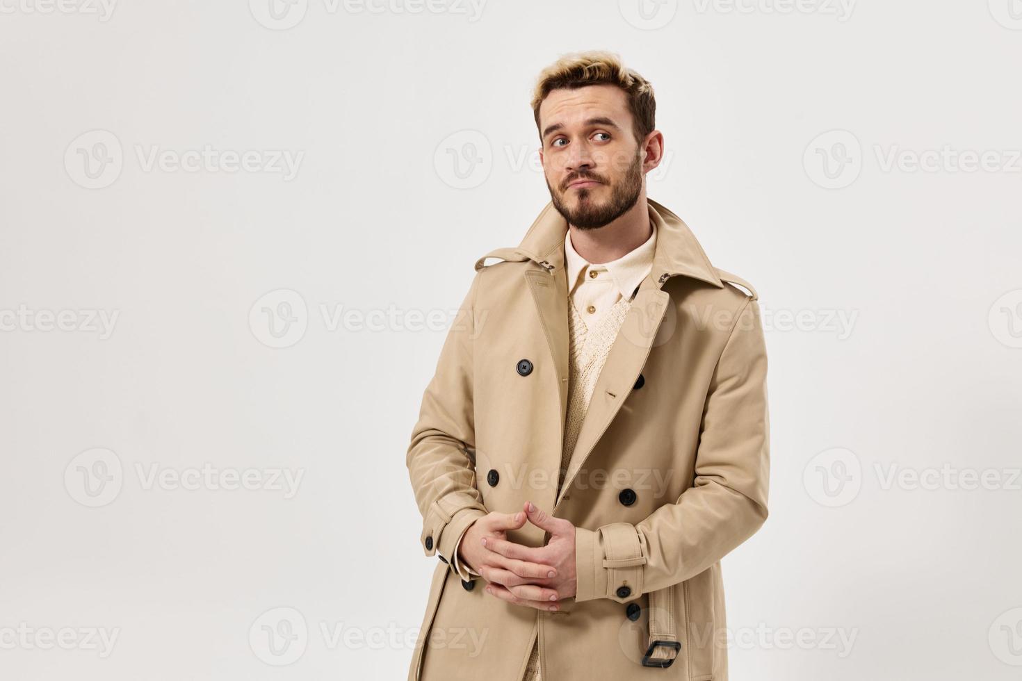 handsome man fashionable hairstyle coat autumn style side glance photo