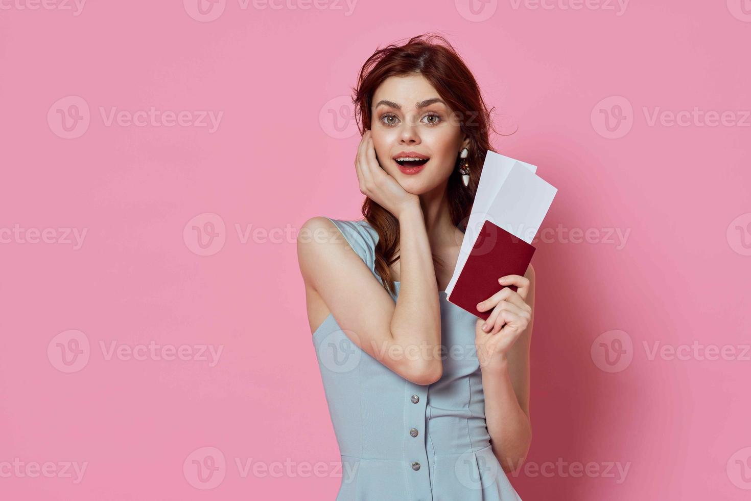 cheerful woman with passport and plane tickets travel lifestyle photo