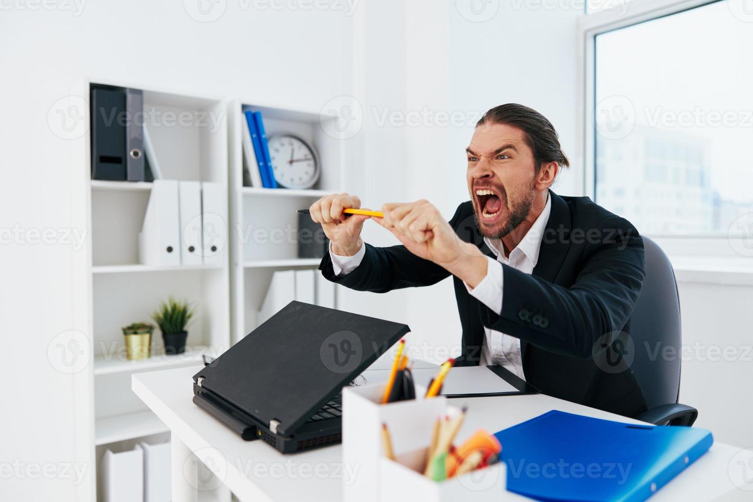 Man emotions work office desk boss photo