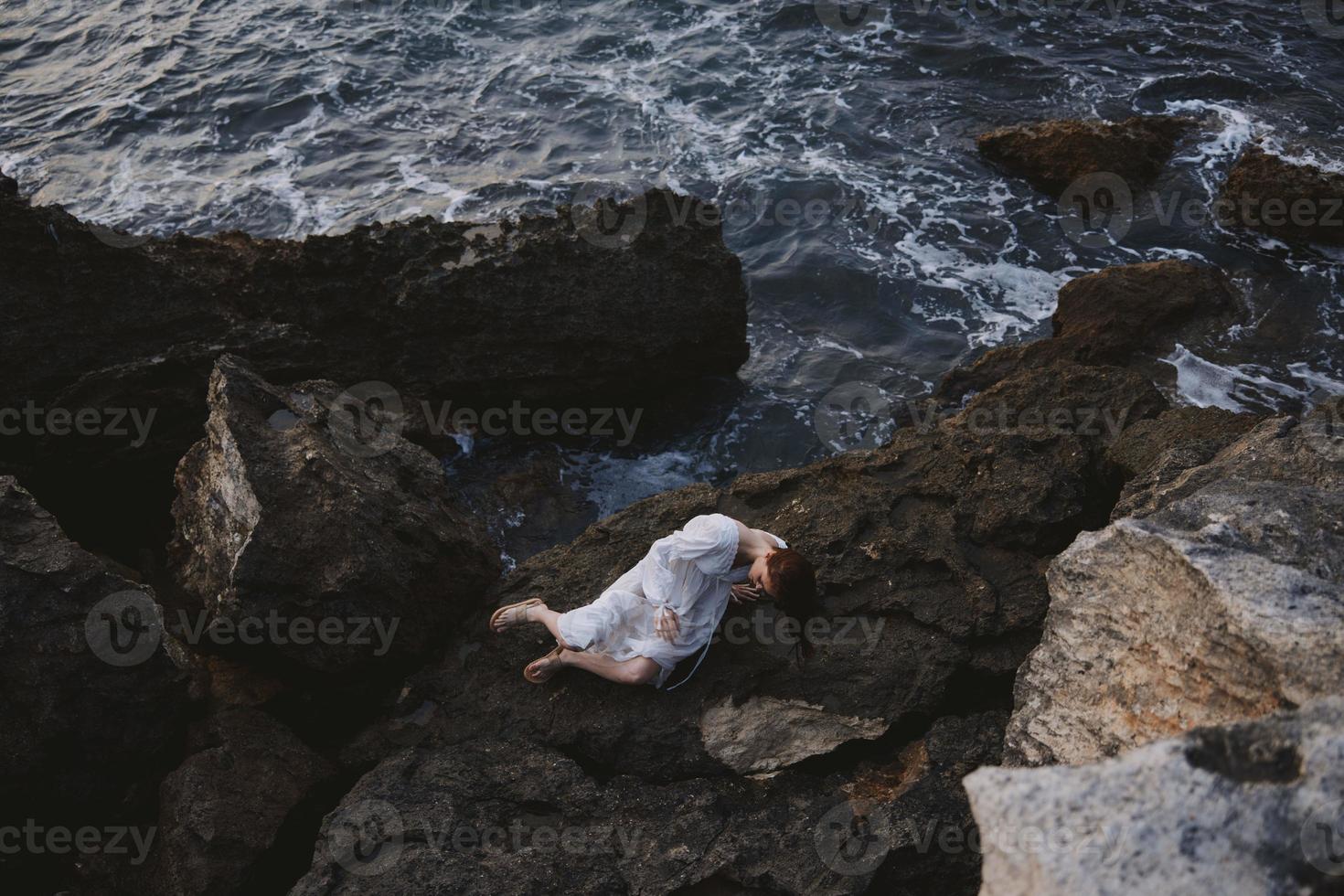 woman in white wedding dress on sea shore wet hair landscape photo