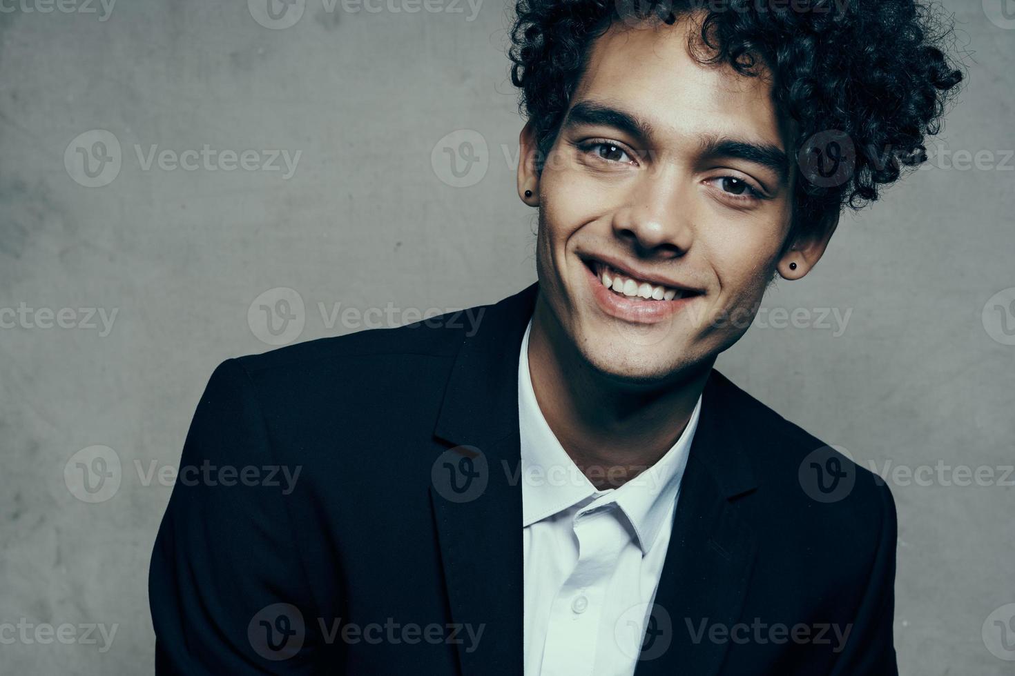 business man in suit curly hair cropped look self-confidence photo