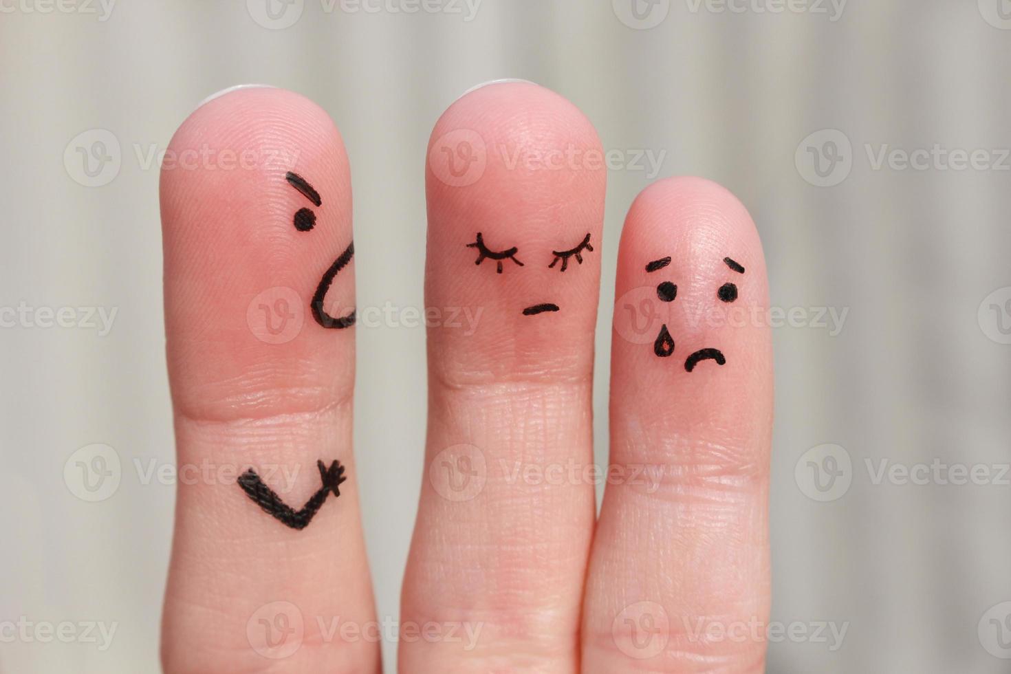 Finger art of a family during an argument. The concept of a man scolds his wife and child, a woman is sad, the baby is crying photo