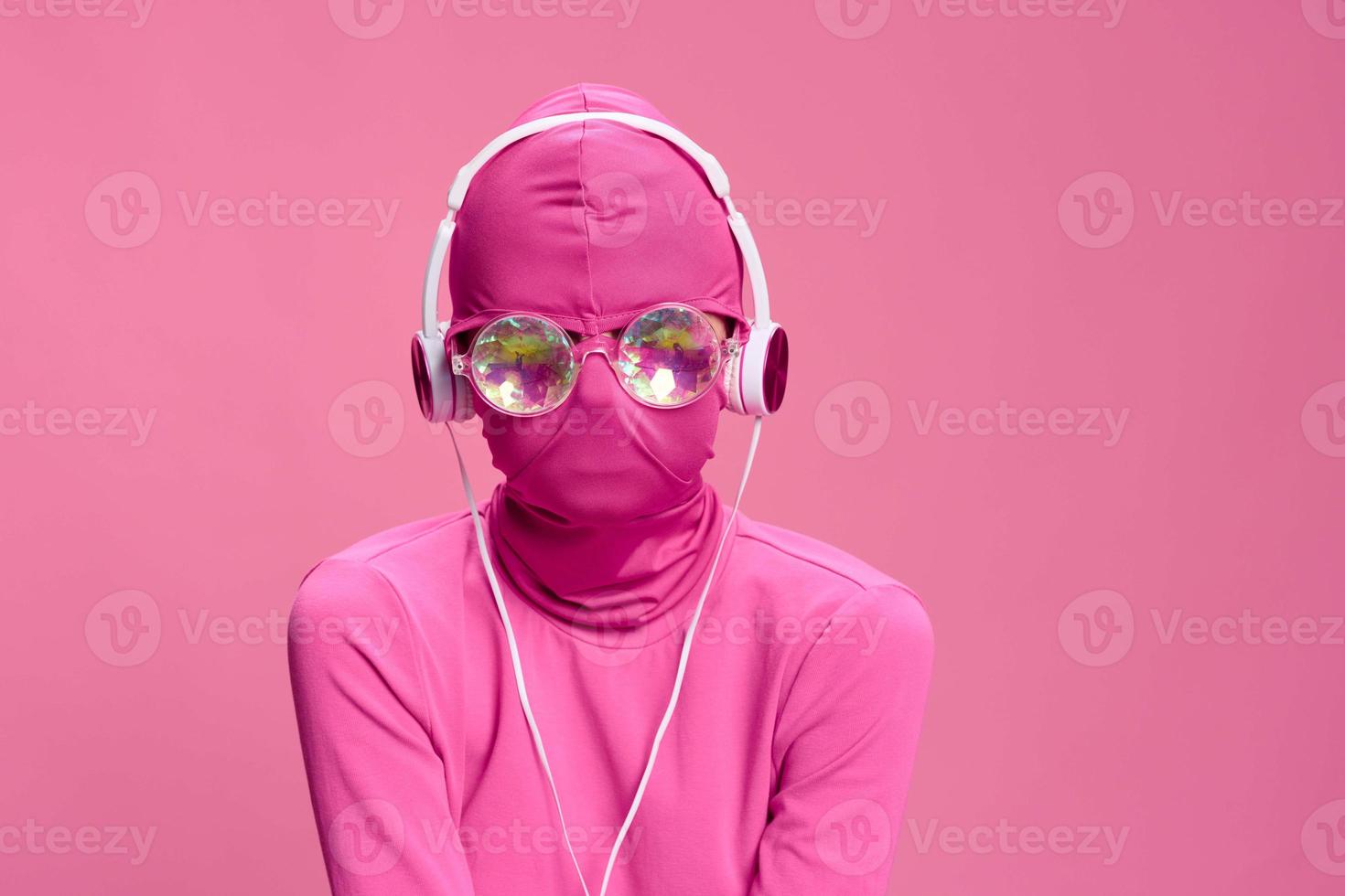 Creative crazy pink photo on a pink background with pink clothes and accessories, cyberpunk concept and conceptual art photography