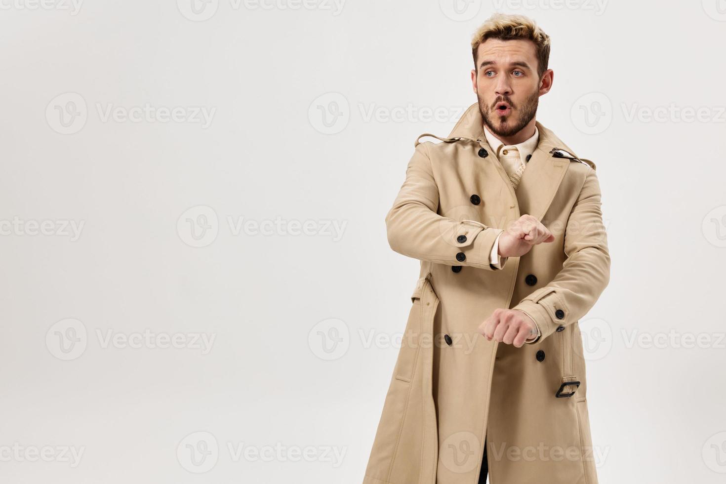 man in coat small fish studio lifestyle isolated background photo