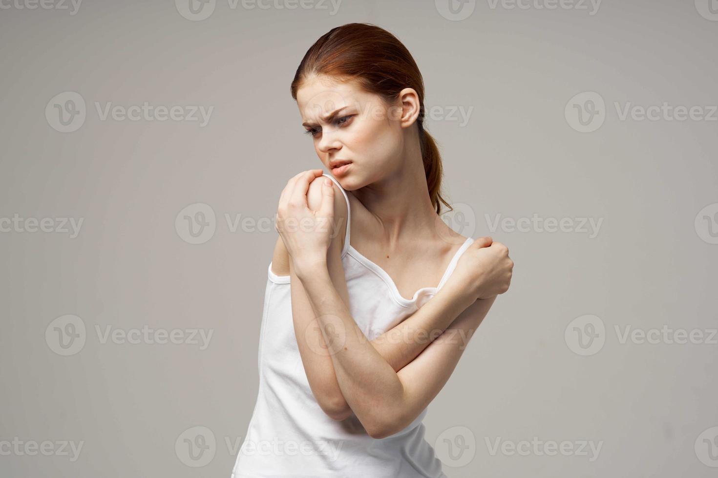 disgruntled woman rheumatism pain in the neck health problems studio treatment photo