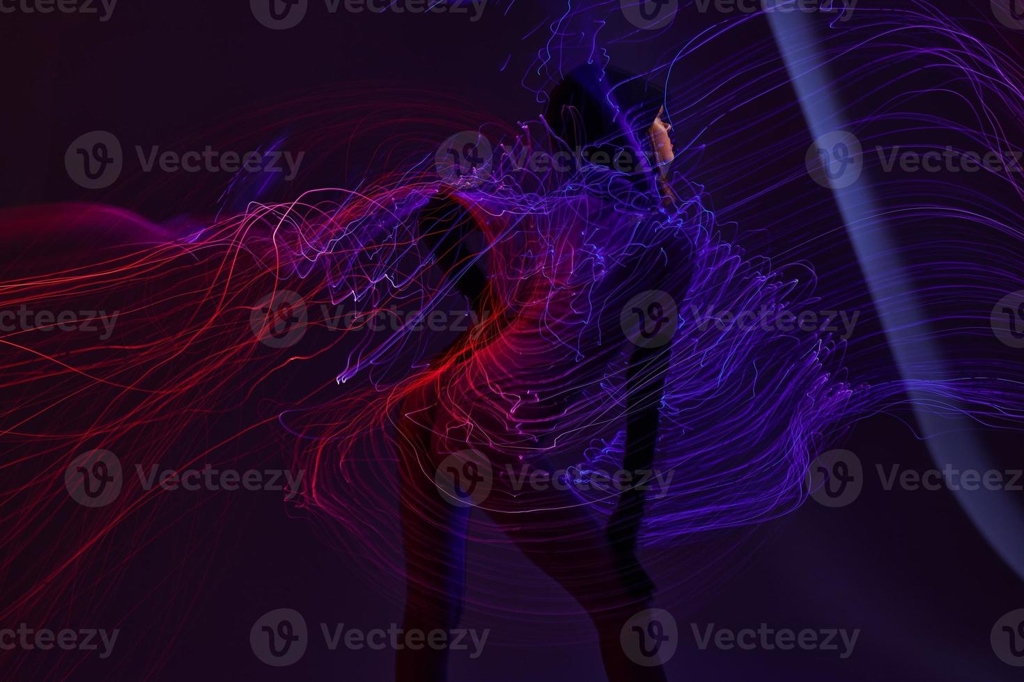 Portrait of a charming lady neon lines light posing color background unaltered photo