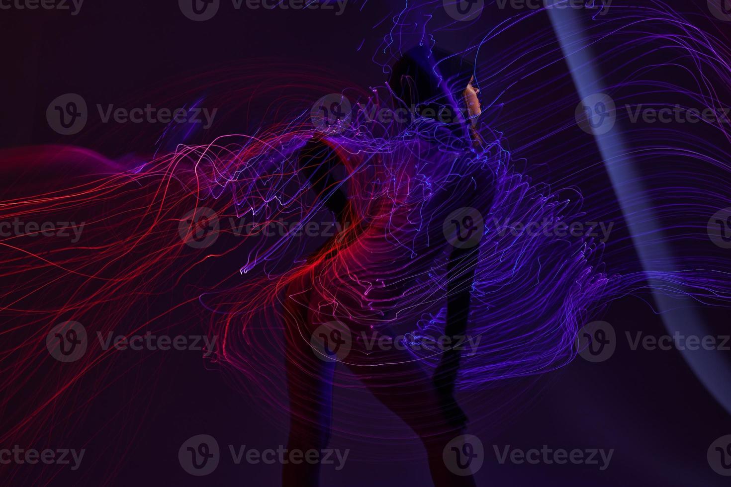 Portrait of a charming lady neon lines light posing color background unaltered photo
