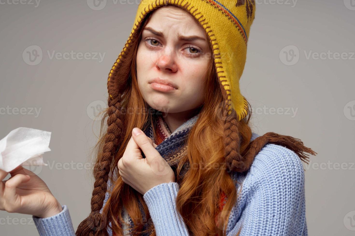 red-haired woman health problems temperature light background photo