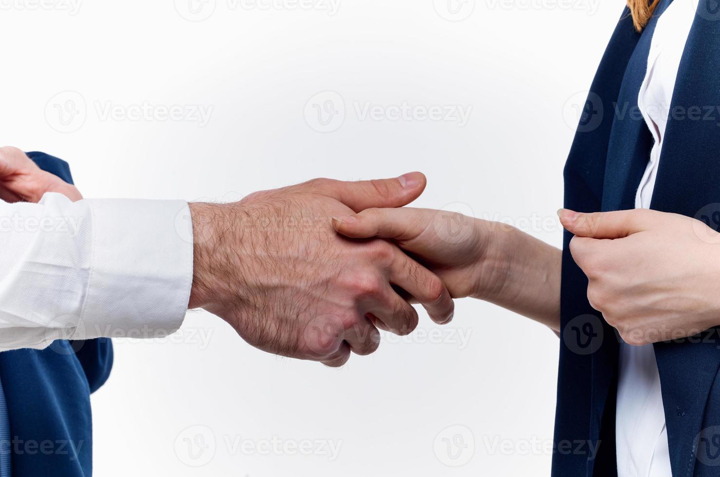 work colleagues shake hands communication contract light background photo