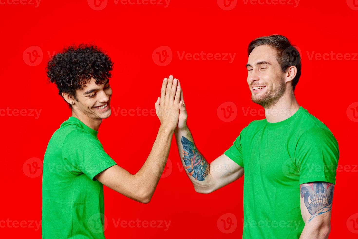 Two cheerful friends holding hands fun emotions photo
