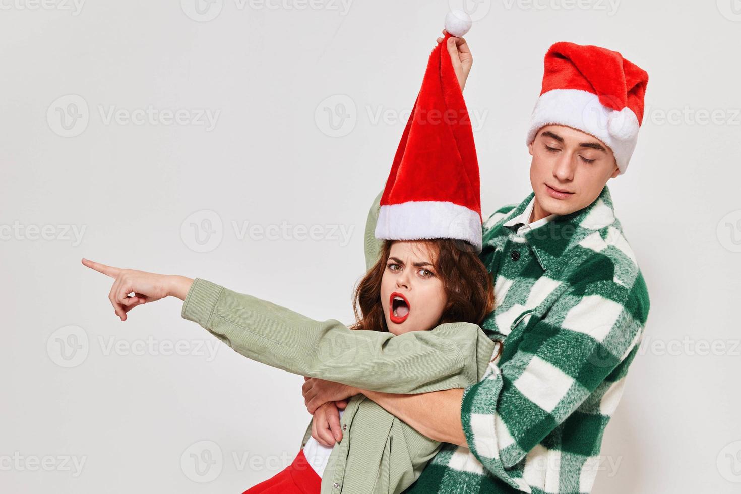 emotional young couple christmas hats holiday friendship togetherness lifestyle photo