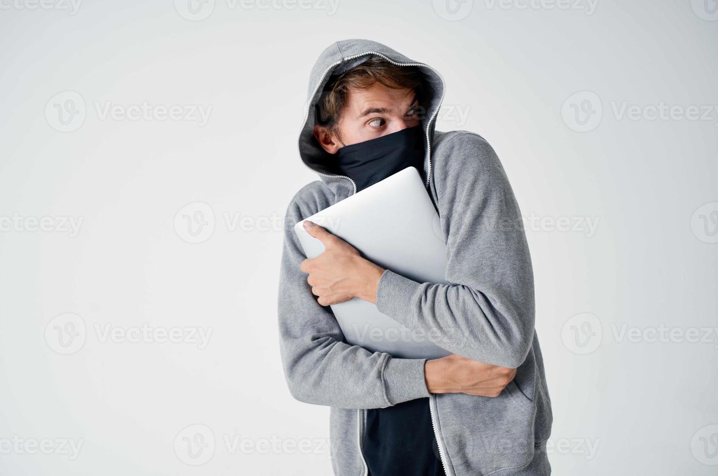 hacker crime anonymity caution balaclava isolated background photo