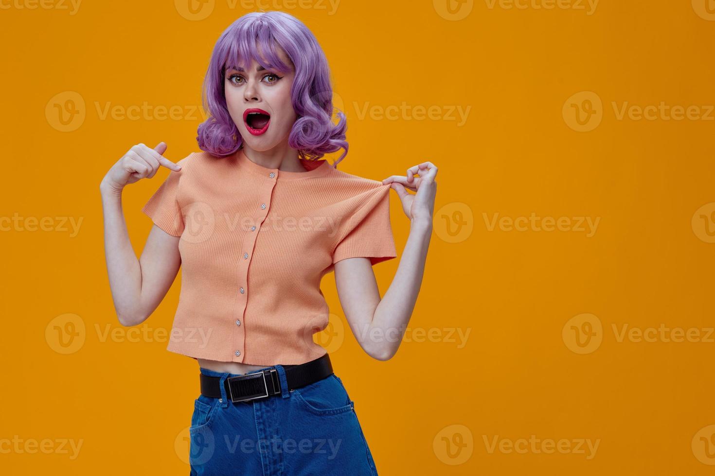 pretty woman purple hair fashion posing glamor yellow background unaltered photo