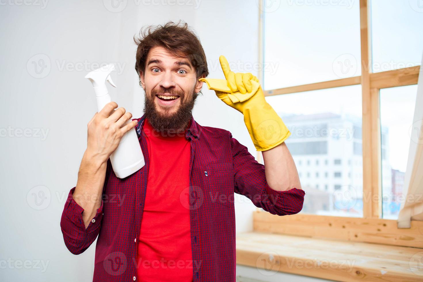 Cheerful man cleaning detergent homework hygiene interior photo